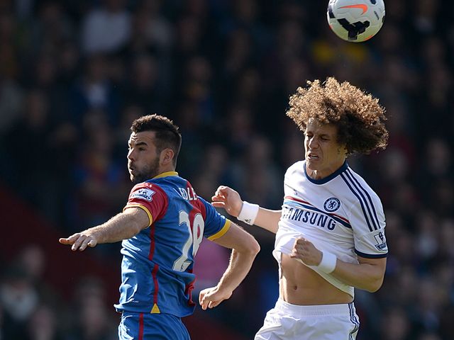 Joe Ledley and David Luiz compete for the ball