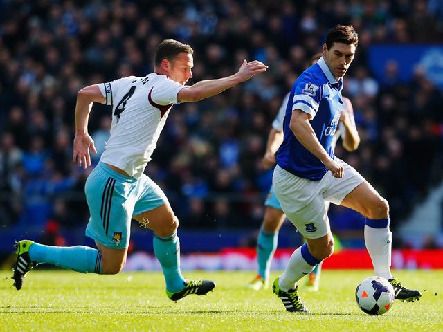 Gareth Barry is closed down by Kevin Nolan