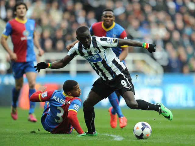 Papiss Cisse gets away from Adrian Mariappa