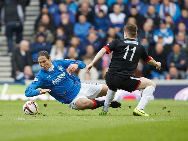 Sebastien Faure is tackled by Alex Whittle