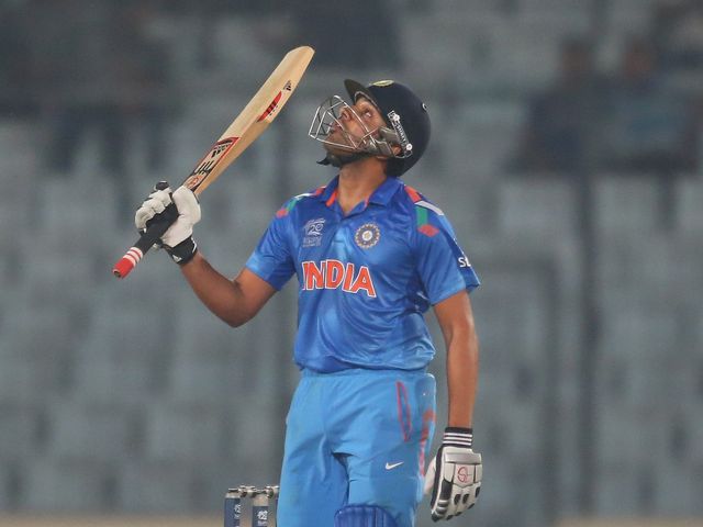 Rohit Sharma celebrates his half century