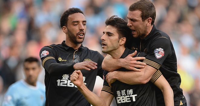 Wigan celebrate a huge upset at Man City