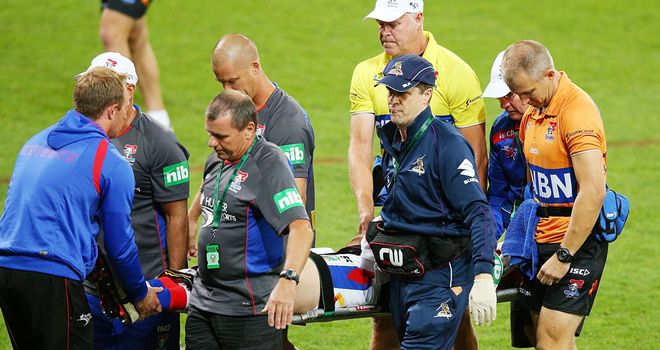 Alex McKinnon is stretchered off after breaking his neck