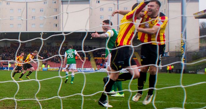 Partick players celebrate their second goal at Firhill Stadium