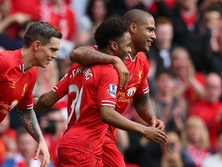 Glen Johnson celebrates with Raheem Sterling during Sunday's 4-0 rout at Anfield