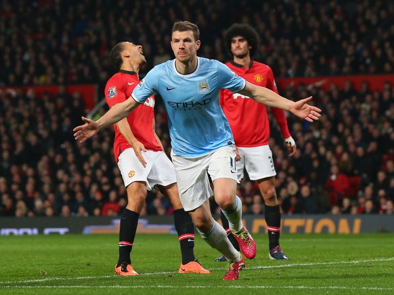 Edin Dzeko celebrates scoring his and City's second goal at Old Trafford