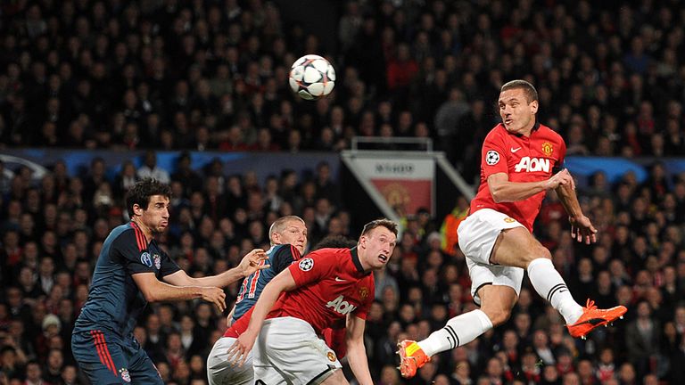 Phil Jones watches on as Vidic heads goalwards in a Champions League tie against Bayern Munich