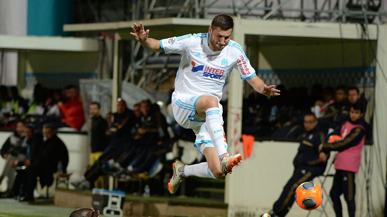 Andre-Pierre Gignac jumps over Idrissa Gueye