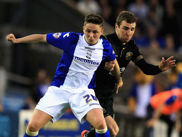 Scott Allan of Birmingham battles with James McArthur of Wigan