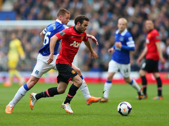 Juan Mata and James McCarthy vie for possession