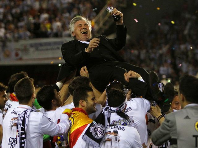 Carlo Ancelotti is thrown into the air in celebration