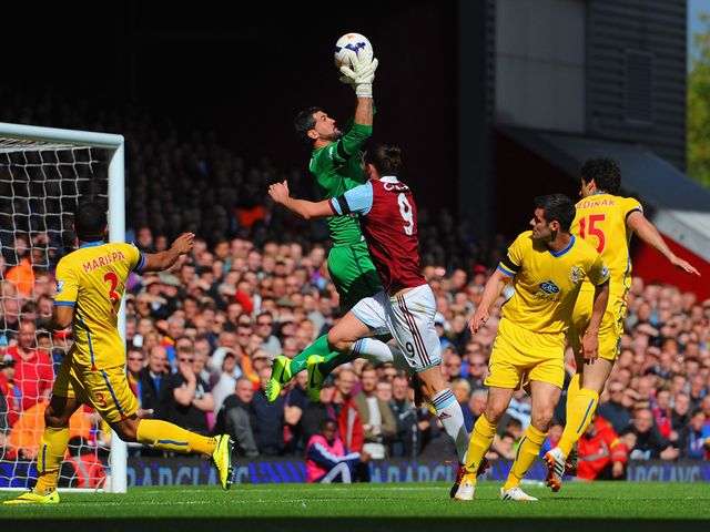 Julian Speroni e makes a save from Andy Carroll
