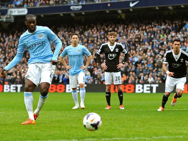 Yaya Toure scores Man City's opening goal from the penalty spot