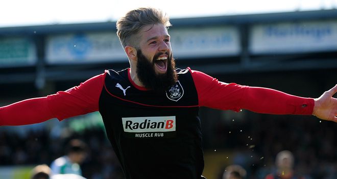 Adam Clayton celebrates Huddersfield's winner