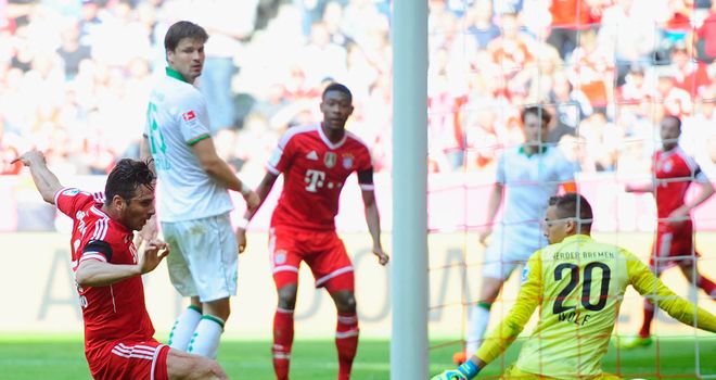 Claudio Pizarro stabs in Bayern's third goal