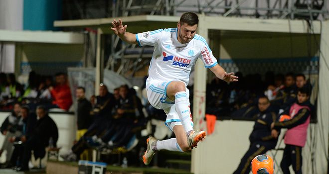 Andre-Pierre Gignac jumps over Idrissa Gueye
