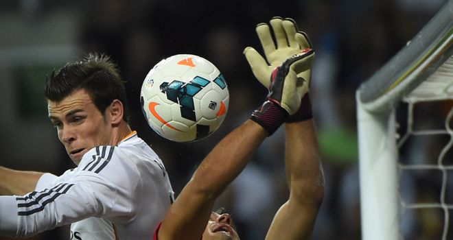Gareth Bale goes up for a header