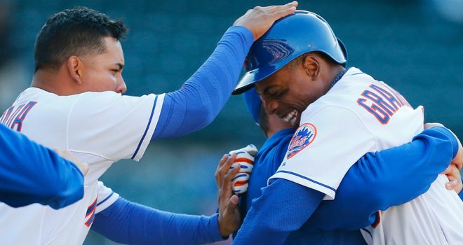 Curtis Granderson: Mobbed by teammates after turning jeers to cheers as New York Mets edged Atlanta Braves