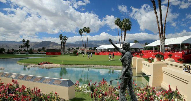 Players on the 18th green behind the statue of Dinah Shore who originated the event in 1972