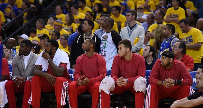 Los Angeles Clippers players wear their warm-up tops inside out