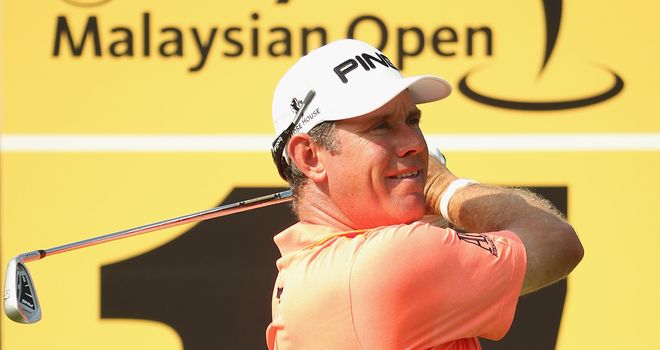 Lee Westwood of England in action during round one of the 2014 Maybank Malaysian Open