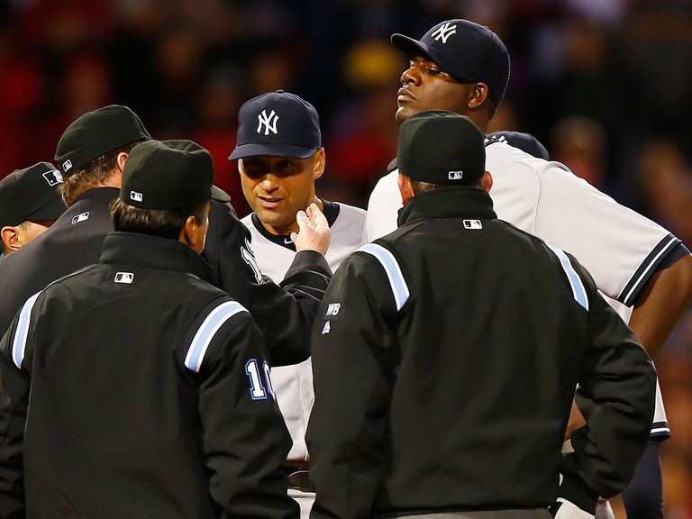 Home plate umpire Gerry Davis throws out Michael Pineda
