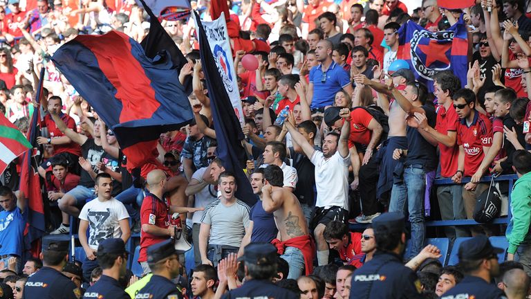 Police contain spectators after a barrier collapsed