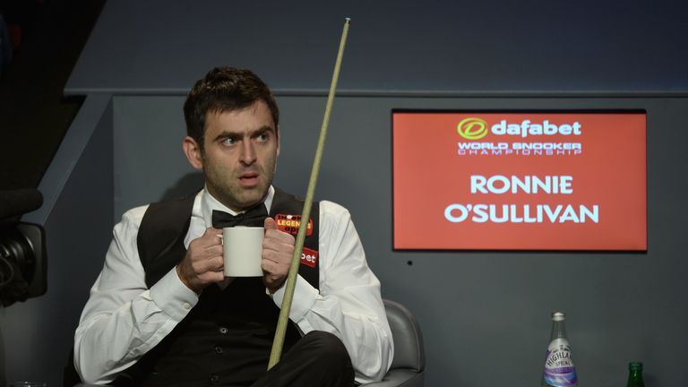 Ronnie O'Sullivan: Defending world champion enjoys a warm drink during first session of his semi-final