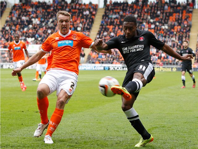 McMahon and Harriott battle for the ball