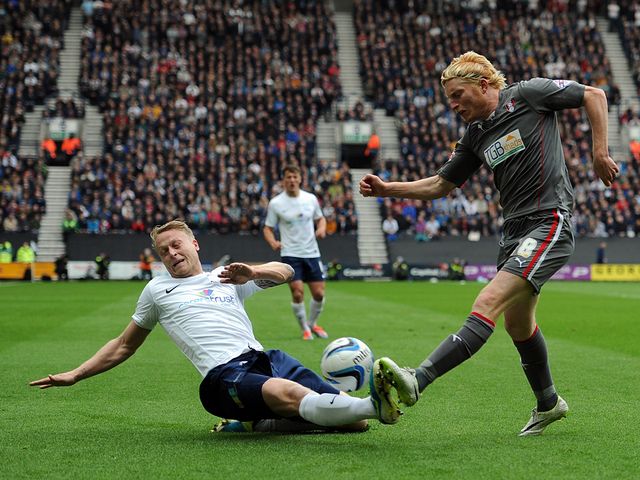 Tom Clarke tackles Ben Pringle