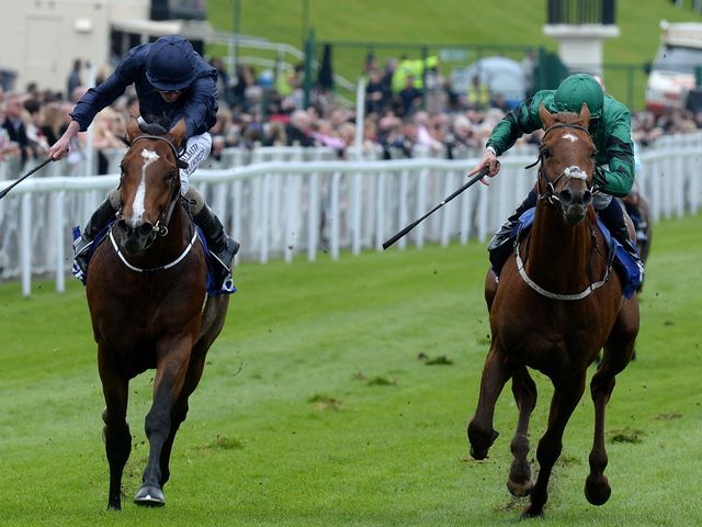 Orchestra (left) ridden by Ryan Moore wins the MBNA Chester Vase from Romsdal 