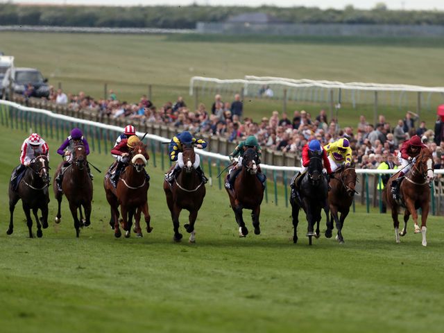 Sole Power (left) comes widest of all to win the Palace House Stakes under Moore.