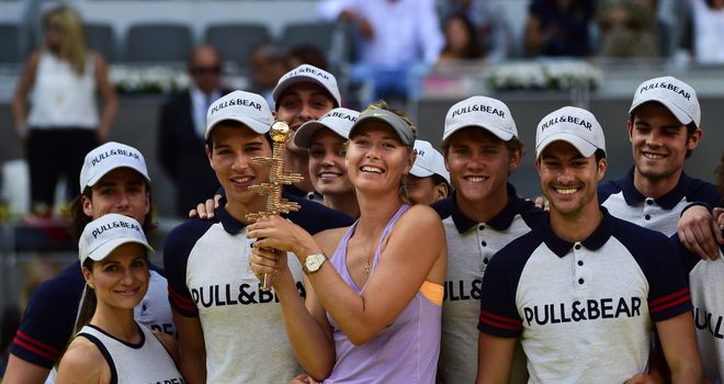 Maria Sharapova poses with the trophy after her first title in Madrid