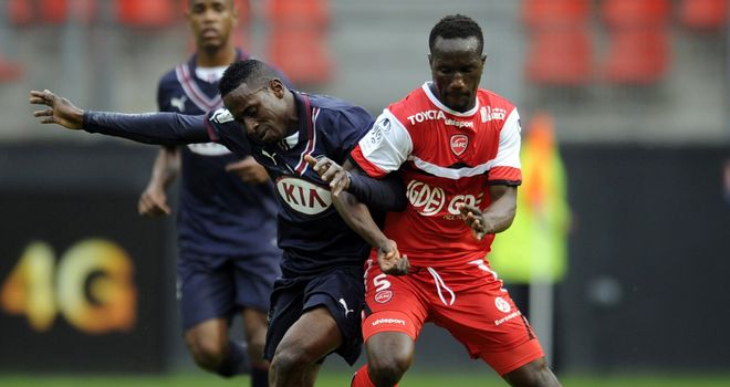 Valenciennes' Benjamin Angoua (right) challenges Andre Biyogo Poko