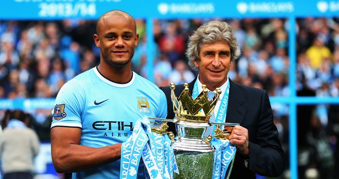 Vincent Kompany and Manuel Pellegrini with the trophy