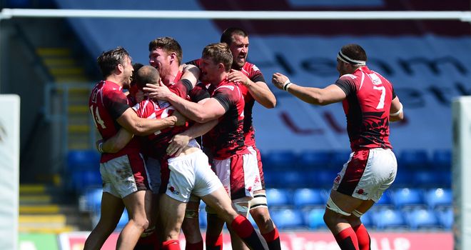 London Welsh players celebrate on the final whistle after clinching victory over Leeds Carnegie
