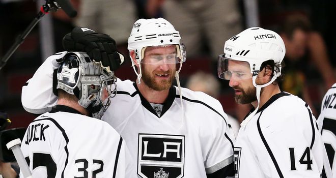 Jonathan Quick, Jeff Carter and Justin Williams celebrate the win over the Blackhawks