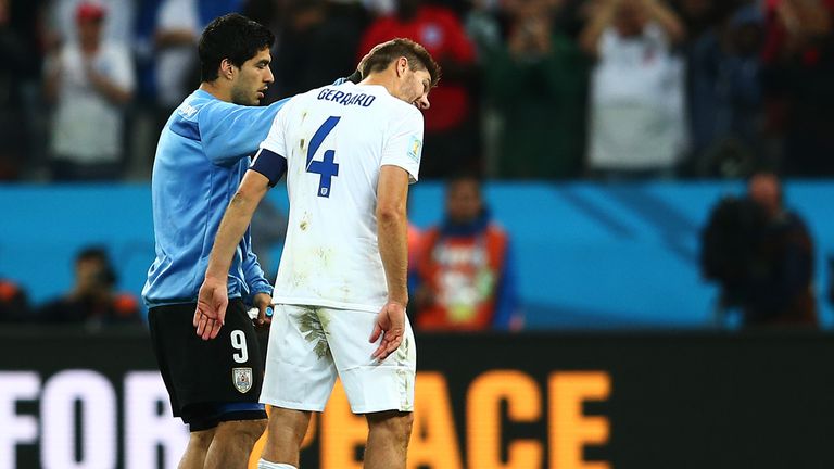 The Liverpool link: Luis Suarez consoles Steven Gerrard after the game