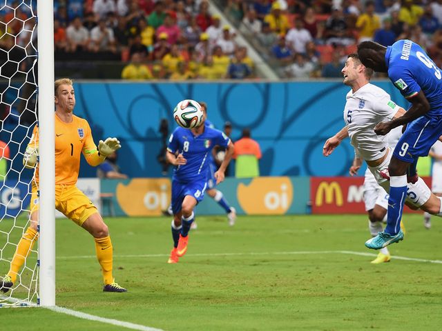 Mario Balotelli heads home the winner for Italy