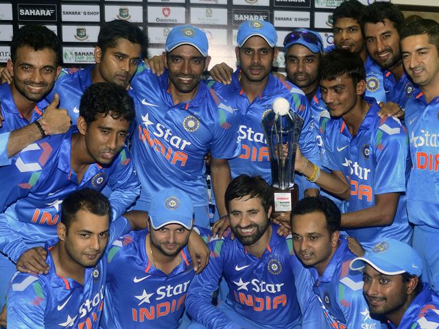 Indian cricketers pose with the trophy at the awards ceremony