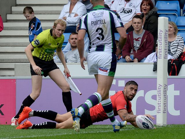 Salford Red Devils' Rangi Chase goes over for a try