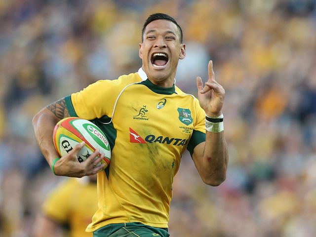 Israel Folau of the Wallabies celebrates as he runs in to score a try