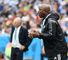 Nigeria's coach Stephen Keshi gestures as Argentina's coach Alejandro Sabella looks on during the Group F football match between Nigeria and Argentina