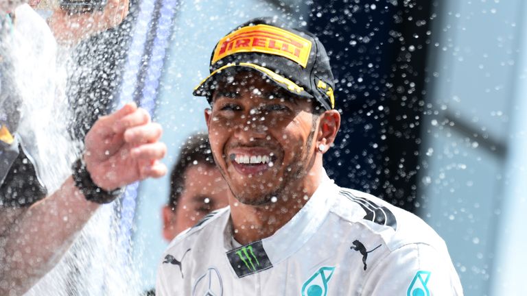 Race winner Lewis Hamilton celebrates