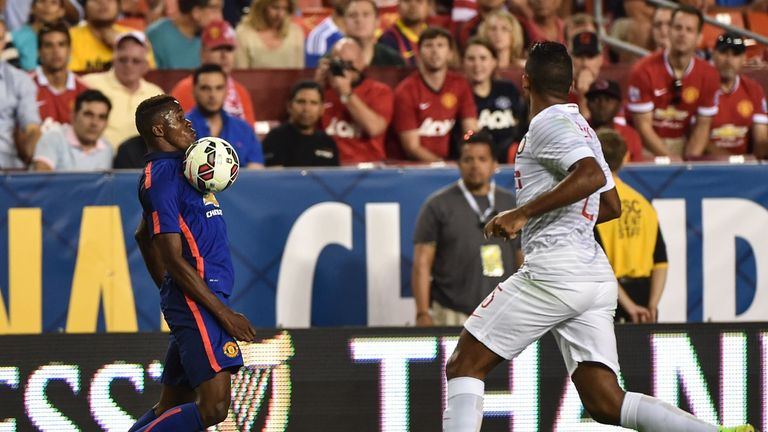 Wilfried Zaha keeps his eye on the ball in Manchester United's clash with Inter Milan