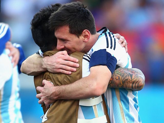Lionel Messi celebrates with Ezequiel Lavezzi