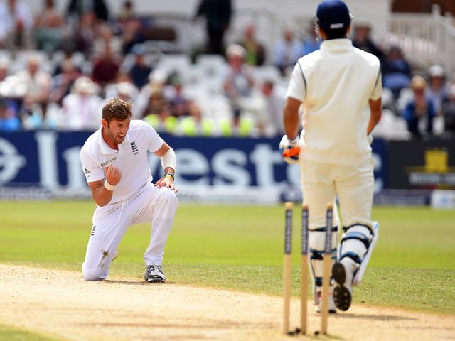 Liam Plunkett celebrates the wicket of MS Dhoni
