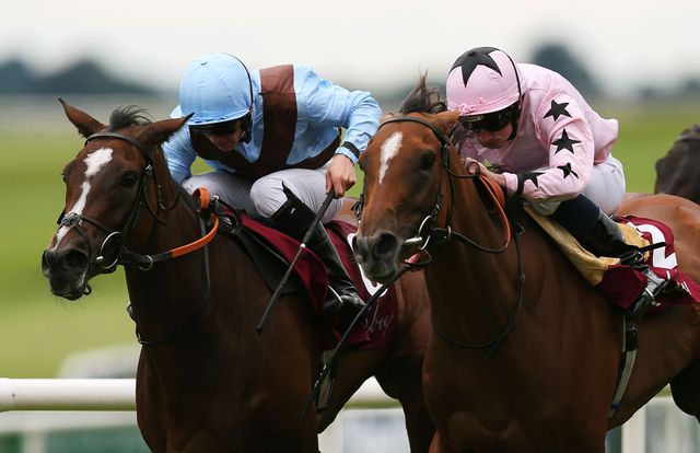 Mango Diva, ridden by Ryan Moore (right), on her way to winning the Kilboy Estate Stakes.