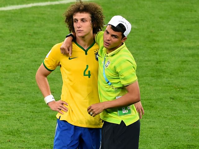 Thiago Silva tries to console David Luiz after the game