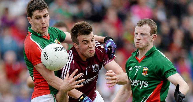 Galway forward Paul Conroy is tackled by Lee Keegan and Colm Boyle during last year's meeting in Salthill